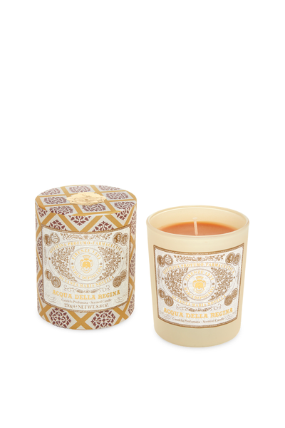 Candle with decorative packaging on a white background