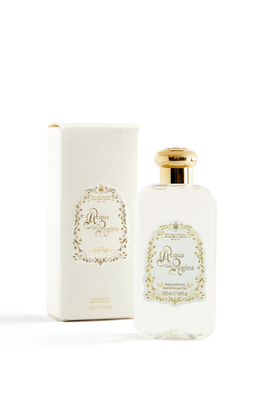 Bottle of acqua della regina bath and shower gel on blank white studio background. Bottle is pictured next to its box. Box has a pale earth tone floral trim around the logo.