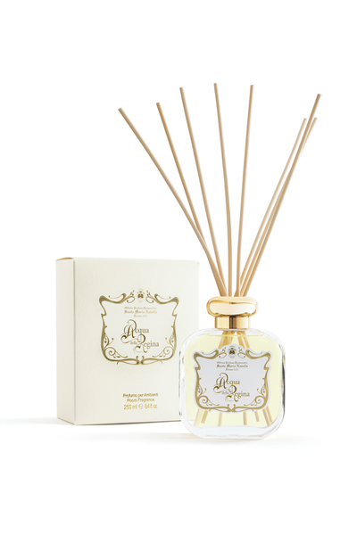 Reed diffuser with packaging on a white background