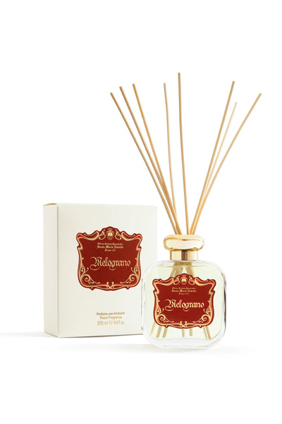 Melograno diffuser bottle with reeds and packaging on a white background