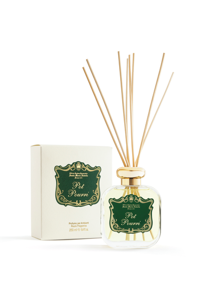 Reed diffuser with packaging on a white background