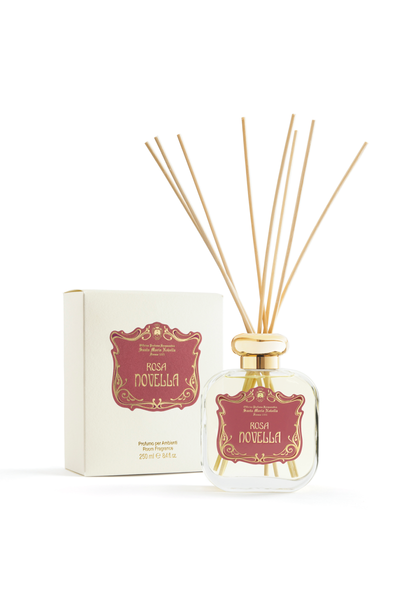 Reed diffuser with decorative packaging on a white background