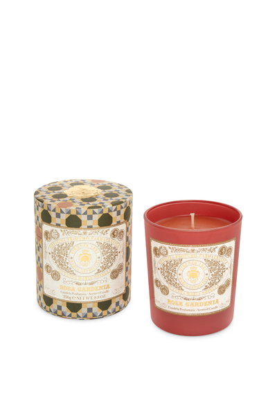 Candle with decorative label on a white background
